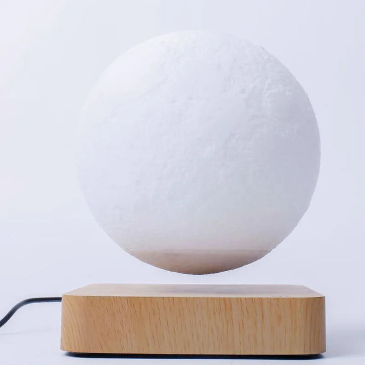 Innovative magnetic levitating moon lamp, LED night light for futuristic home decor & ambient glow.