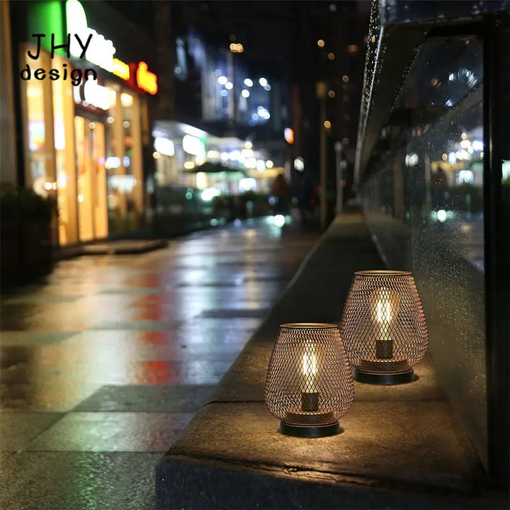 Portable LED lantern set lighting a patio & living room. Versatile battery operated ambient light for indoor/outdoor.