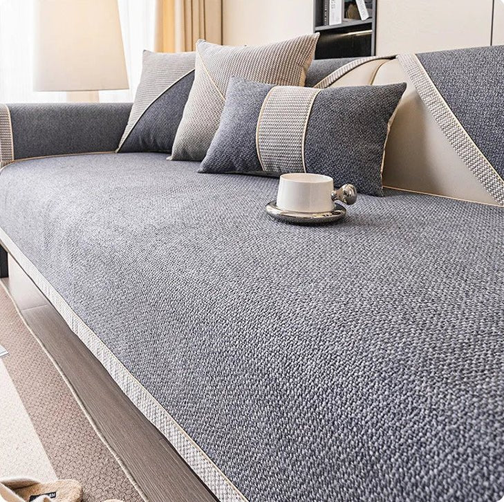 Neutral cotton-linen non-slip sofa cover protects your living room furniture. Ideal for all-season home comfort & pet-friendly.