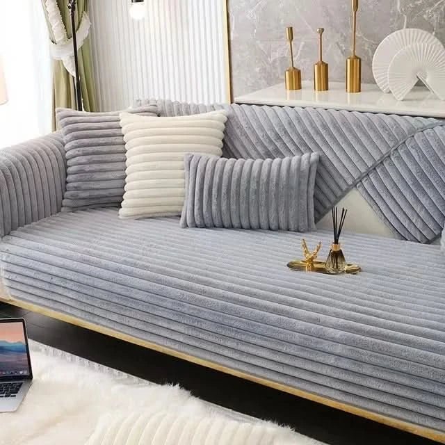 Waterproof, non-slip sofa cover in solid color protecting your couch from spills & pets. Ideal for living room comfort.