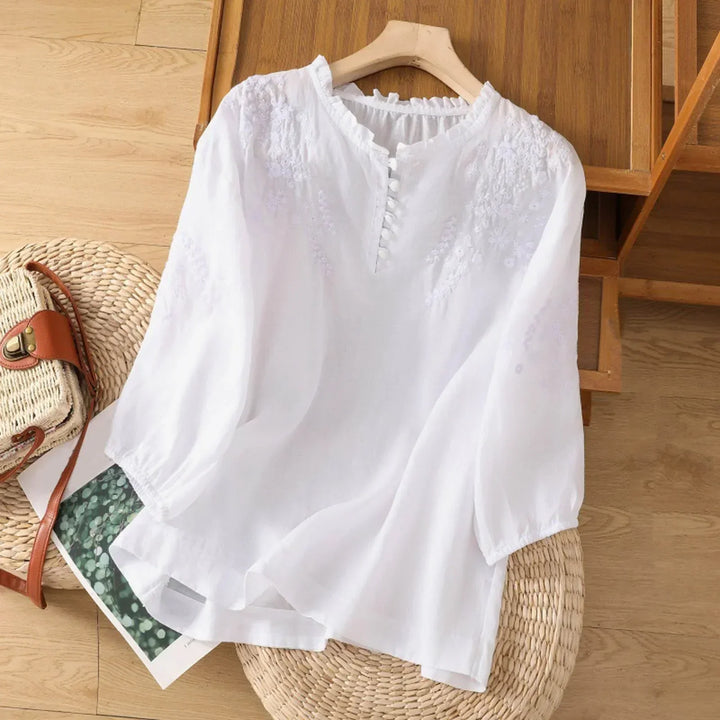 Versatile women's button-front blouse with delicate embroidery, elbow sleeves, offering effortless and elegant style.