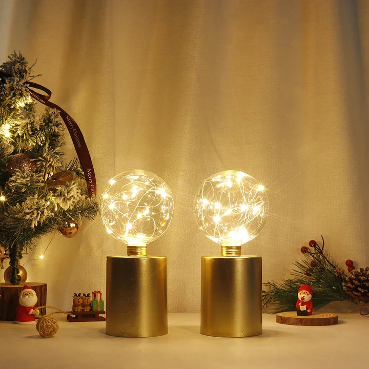 Stylish gold cordless LED table lamp duo. Provides convenient battery-powered lighting for sophisticated home decor.