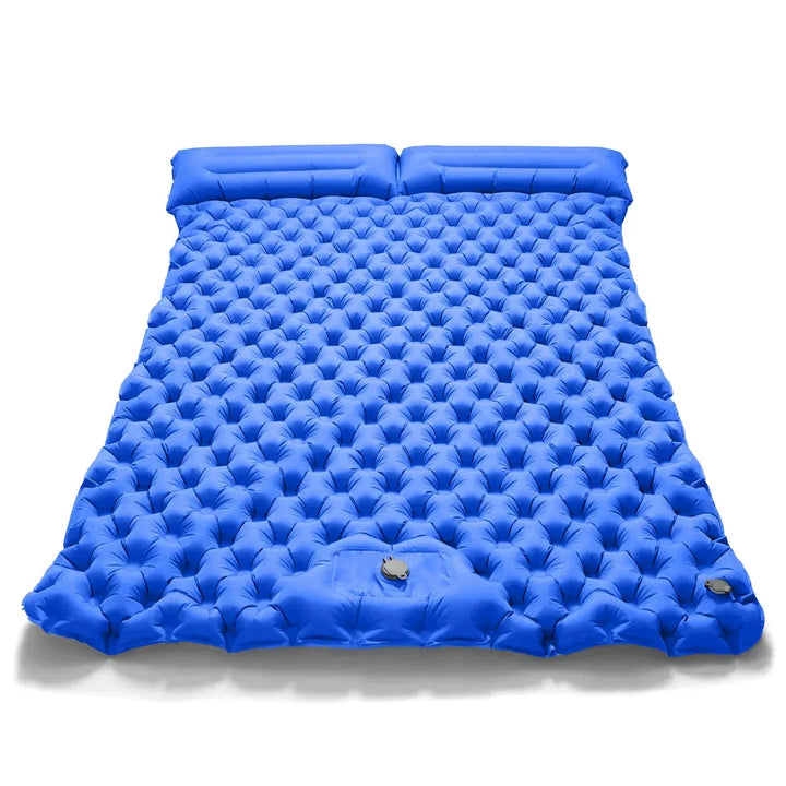 Dual camping air bed in tent. Comfortable inflatable mattress for two, with integrated pump for easy setup.