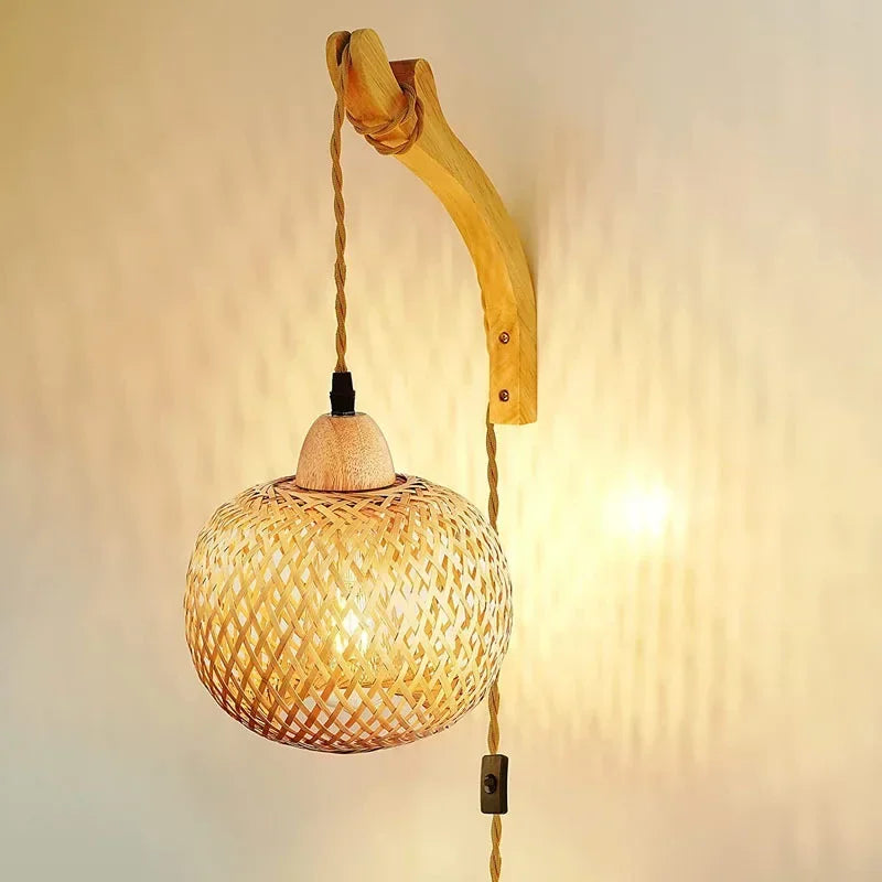Natural handwoven rattan wall light, ideal for bohemian or rustic home accent & lighting.