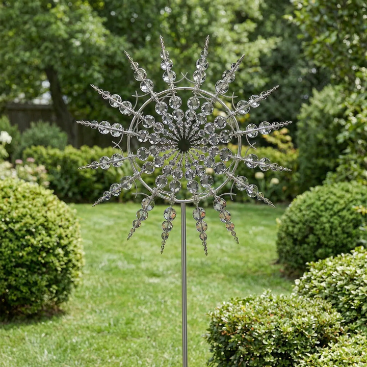 Kinetic metal wind spinner for garden decor, weather-resistant yard art with ground stake for outdoor spaces.