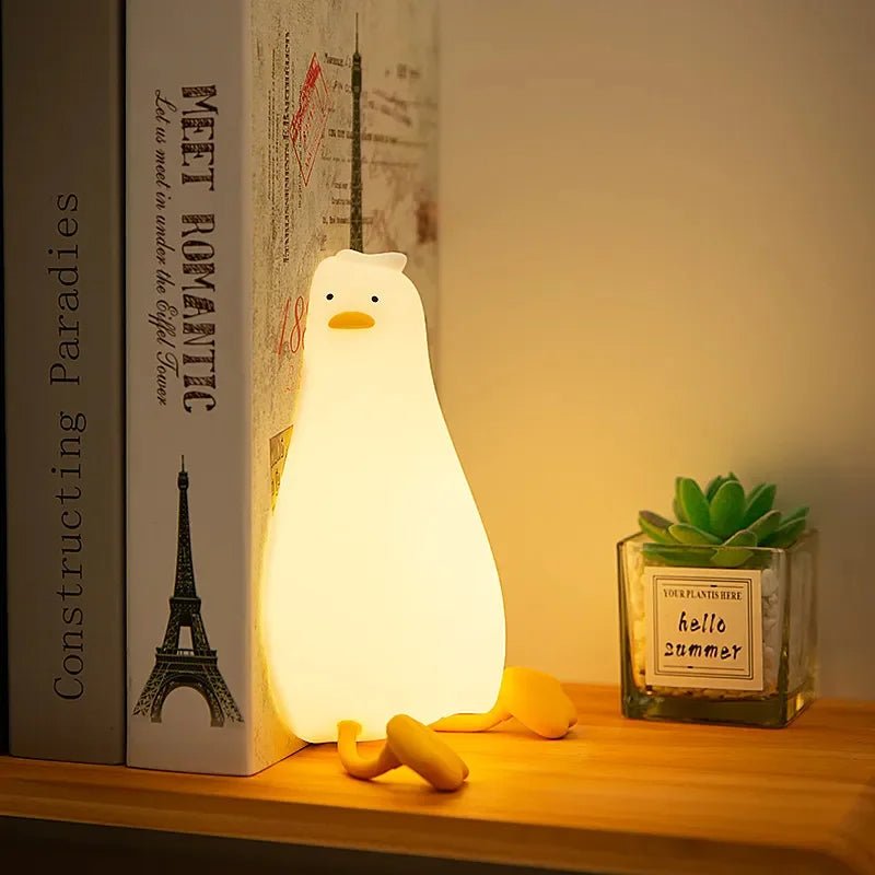 Soft silicone dimmable night light, safe for kids & babies, provides a warm, cozy glow for sleep.