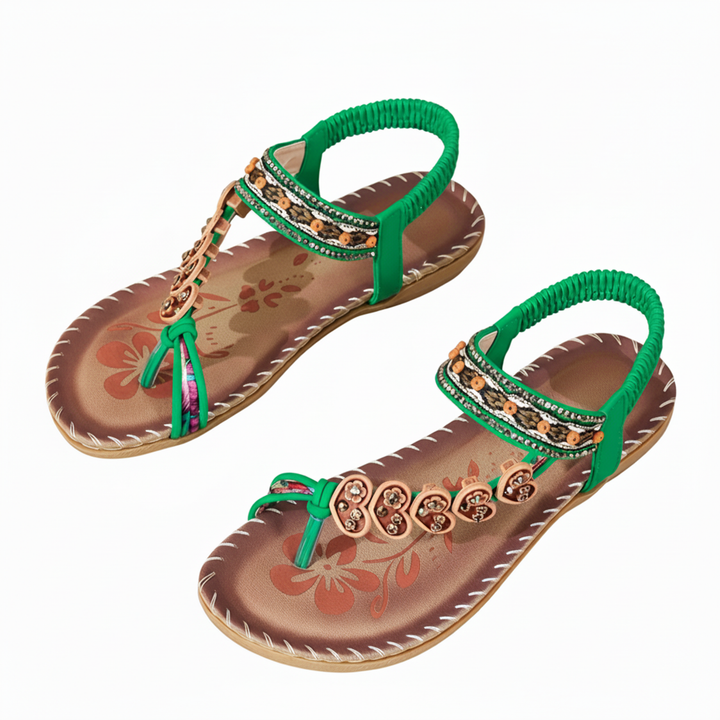 Woman walking in comfortable women's bohemian thong sandals with ankle strap. Stylish flat summer casual shoes.