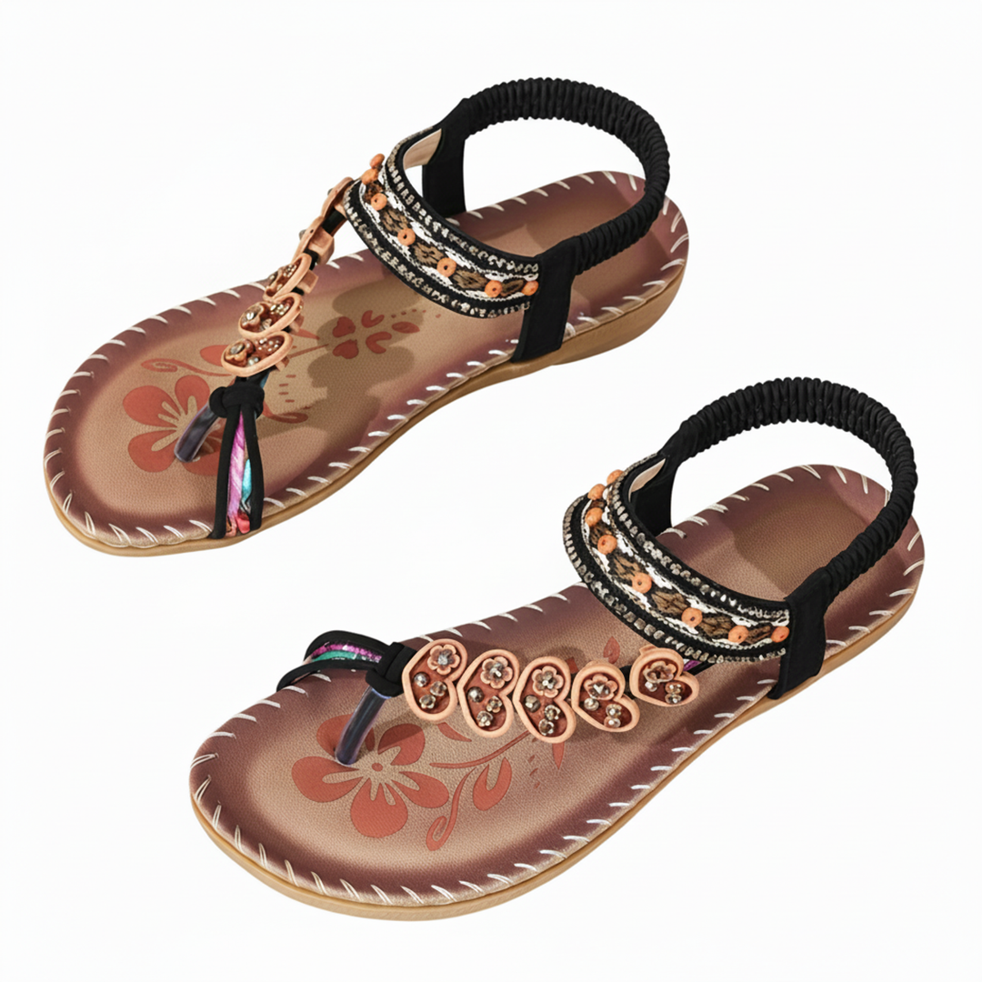 Stylish women's bohemian thong sandals featuring a vibrant floral design & chic ankle strap for trendy summer outfits.