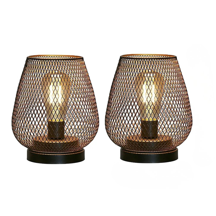 Hand holding a portable LED lantern from the set, battery operated for easy indoor or outdoor ambient lighting.