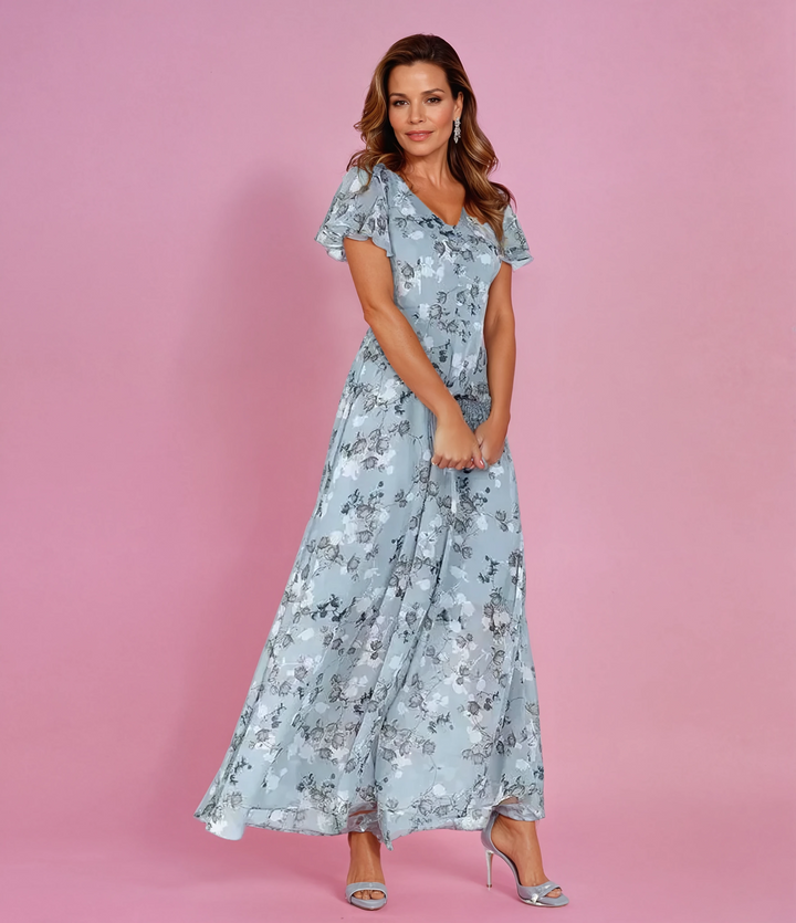 Elegant women's floral maxi dress with flutter sleeves, perfect for summer parties or wedding guests.