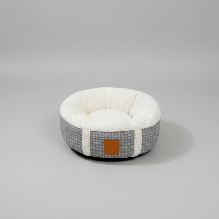 Washable calming cat & small dog bed. Super-soft plush pet nest for cozy winter sleep, ideal for indoor use.