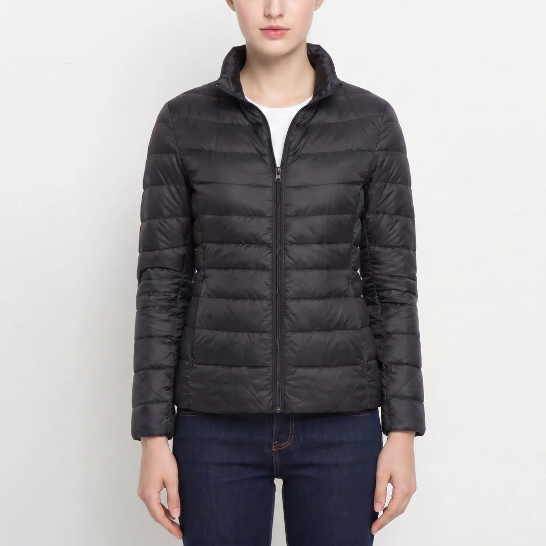 Elegant women's quilted puffer jacket with a sleek, slim fit. Perfect for cozy autumn warmth.