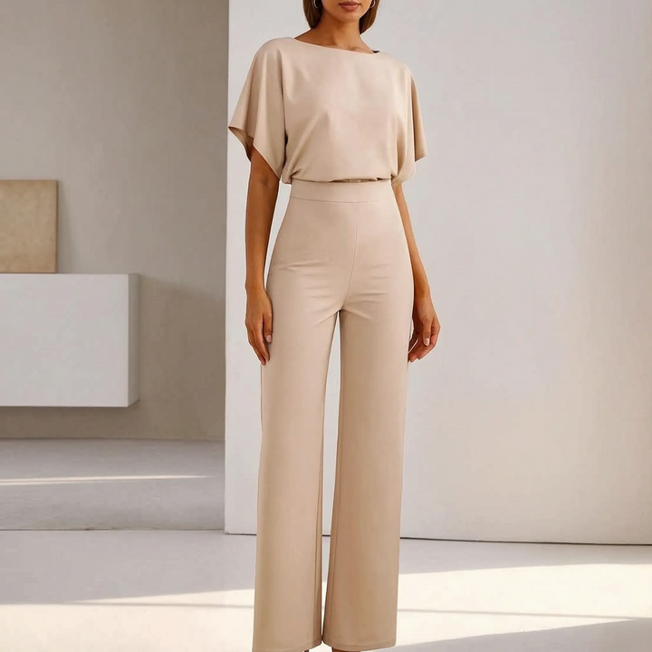 Women's elegant wide-leg jumpsuit with stylish batwing sleeves and a flattering belted waist. Perfect for versatile wear.