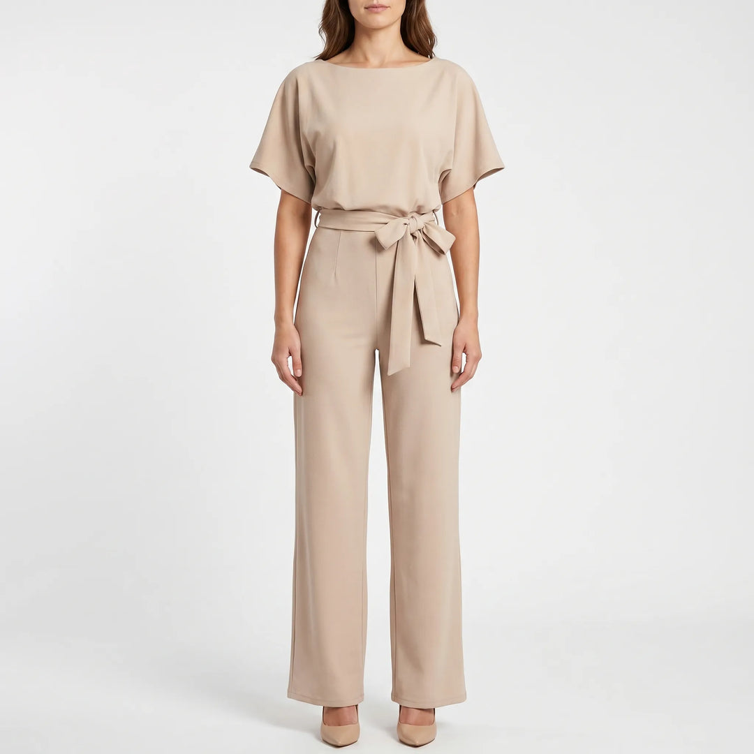 Elegant wide-leg jumpsuit for women, featuring unique batwing sleeves, a keyhole back, and a flattering belted silhouette.