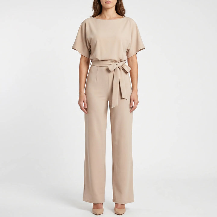 Elegant wide-leg jumpsuit for women, featuring unique batwing sleeves, a keyhole back, and a flattering belted silhouette.