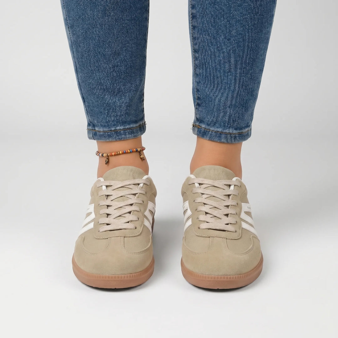 Women's retro-style trainers featuring vibrant stripes and secure laces for casual comfort.