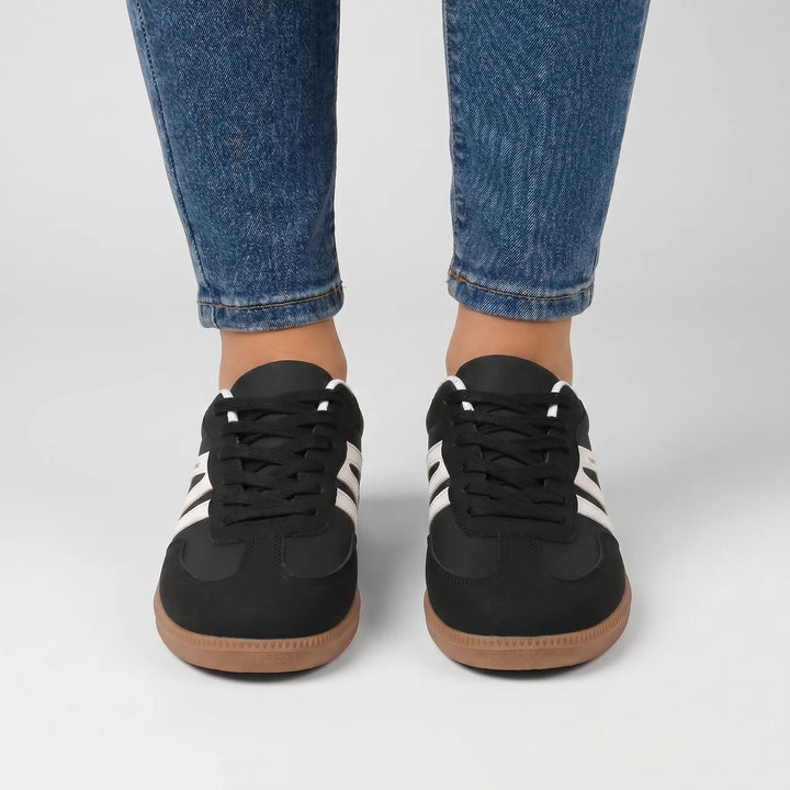 Fashionable women's retro-stripe lace-up sneakers offering comfort for everyday wear.