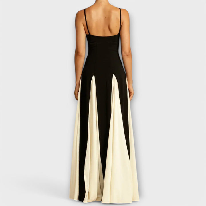 Comfortable black women's flowy maxi sundress. Spaghetti strap design, ideal for versatile casual summer fashion.