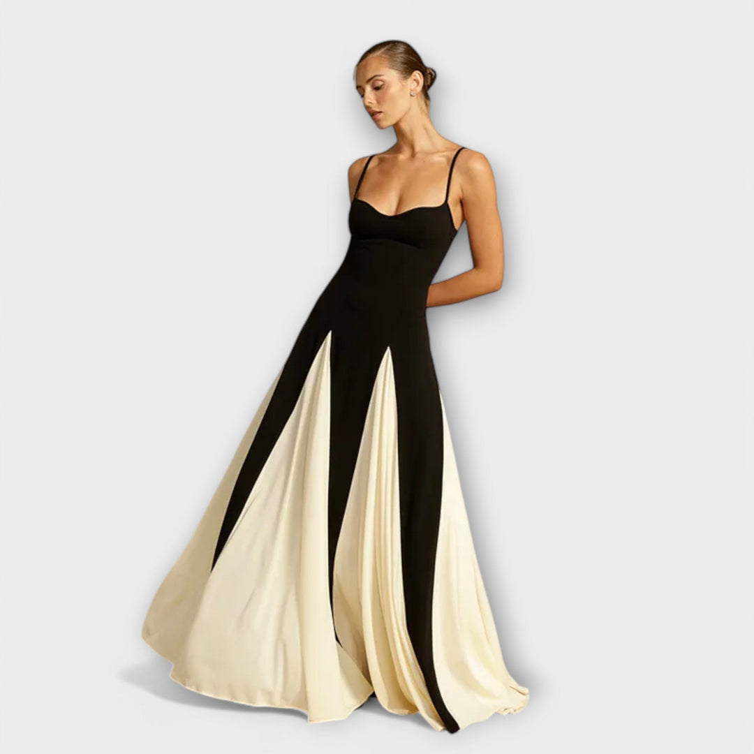 Black women's flowy maxi sundress with spaghetti straps, perfect for casual summer wear & comfortable elegance.