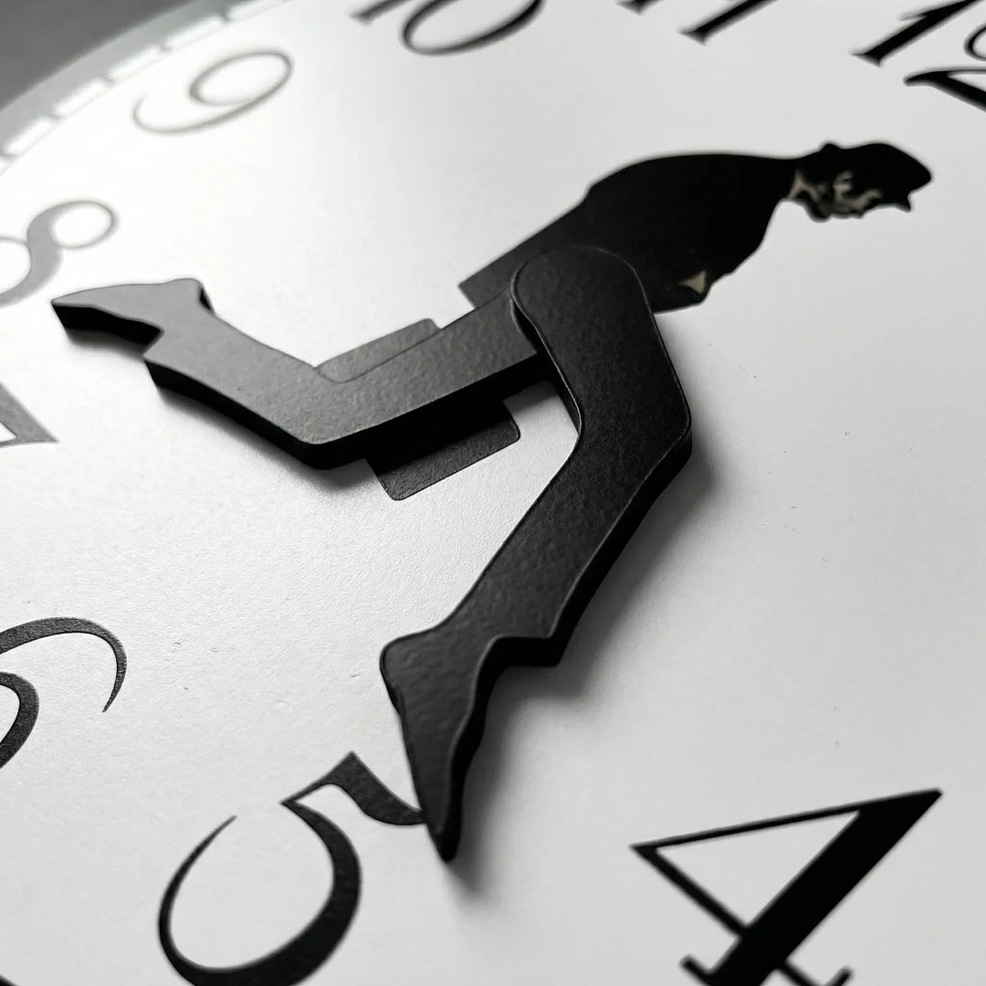 Playful whimsical wall clock; a modern home accent. Easy-read timepiece for stylish living room or office decor.