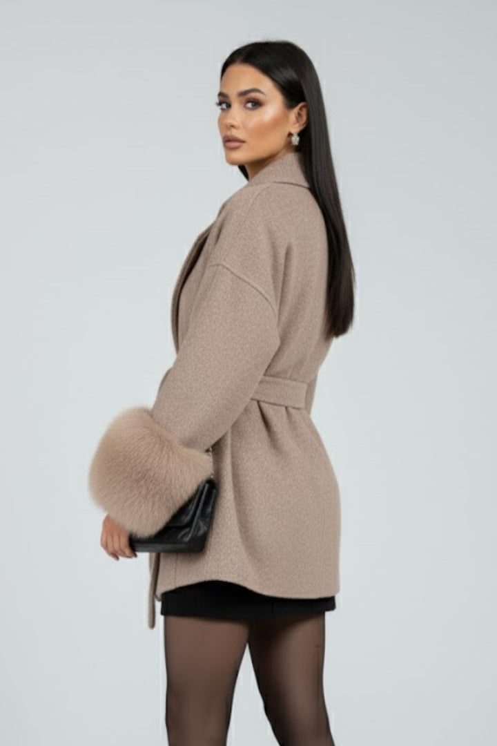 Ladies elegant long winter jacket. Full length, belted design with luxurious faux fur cuffs. Stay warm in style.