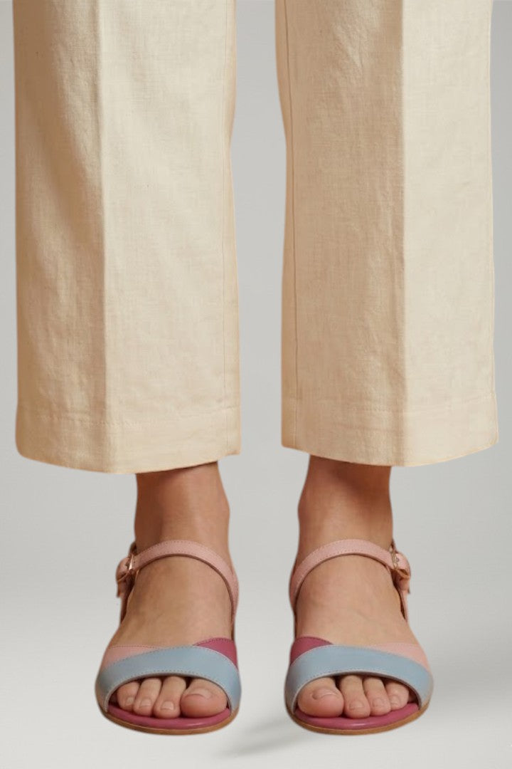 Pink women's flat sandals featuring an adjustable strap & cushioned insole for casual summer comfort.