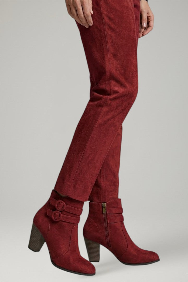 Fashionable women's buckle boots, tall cowboy style with a sturdy heel. Versatile ladies western footwear for any outfit.