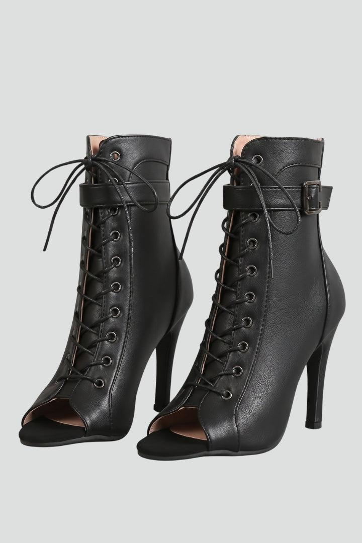 Elegant women's black strappy open-toe stiletto heels with buckle, perfect for evening wear & parties.