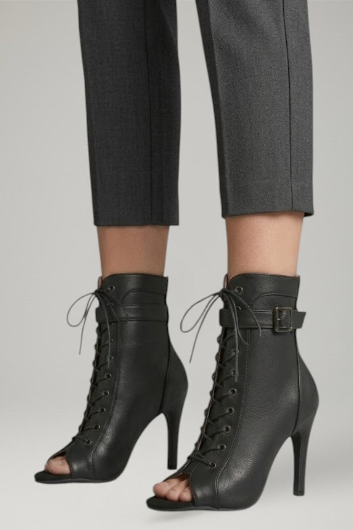 Sophisticated women's dress heels: open-toe, strappy black design with a sleek stiletto for evenings.
