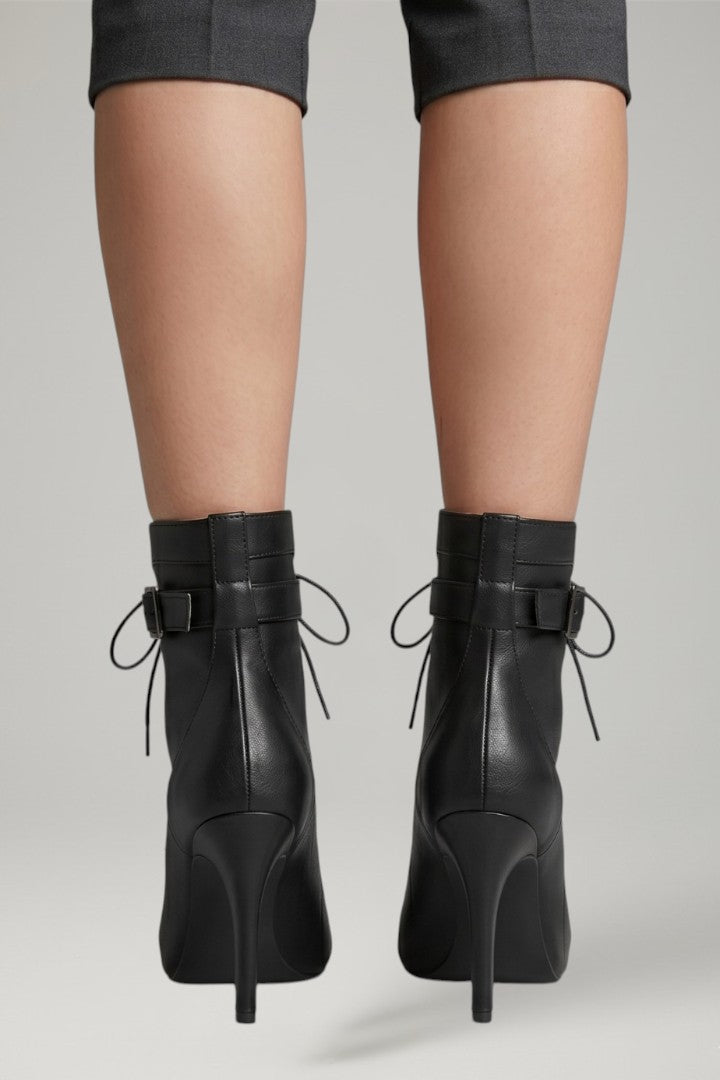 Glamorous women's black open-toe strappy heels with a secure buckle, elevating any evening outfit.