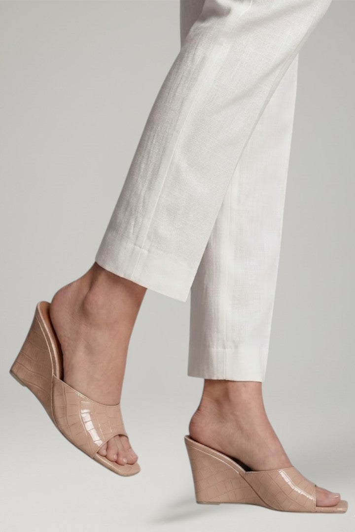 Sunny yellow women's wedges, providing cushioned comfort & an elegant slip-on style for vibrant summer outfits.