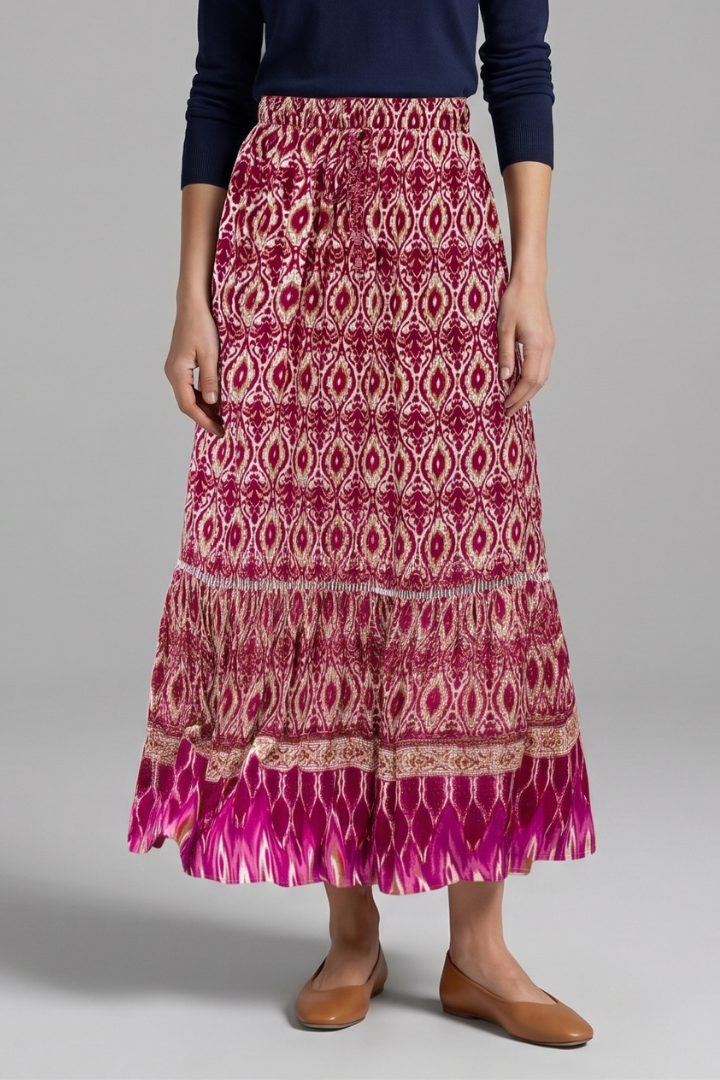 Women's tiered flowy maxi skirt with a comfortable elastic waist, perfect for spring/summer elegance.