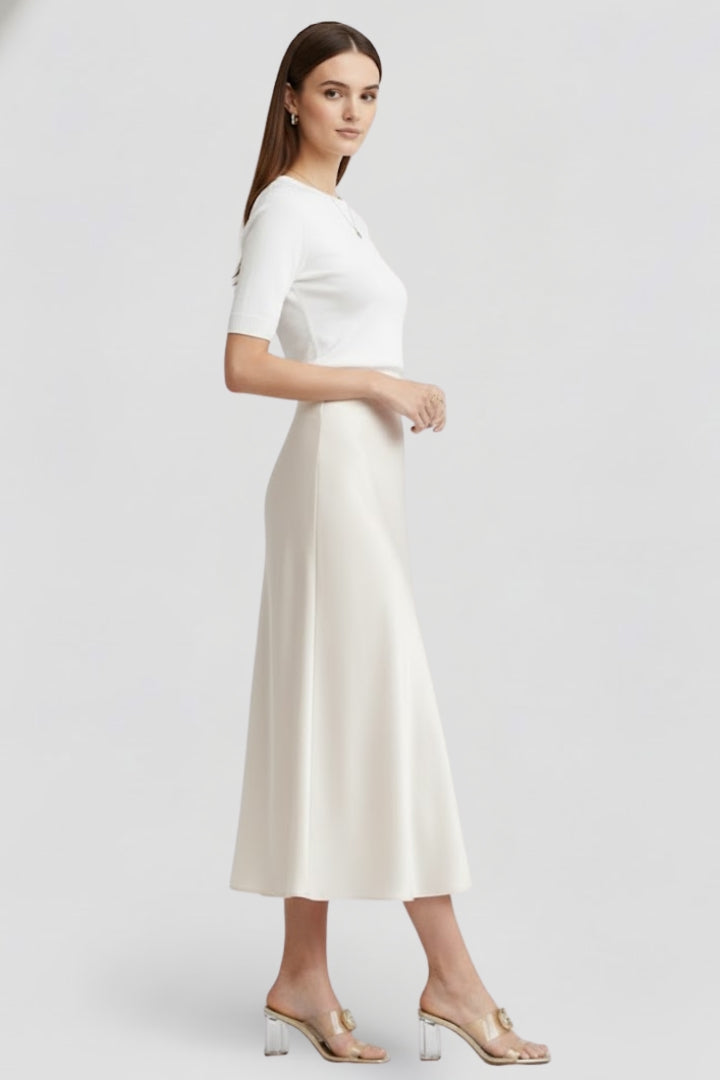 Crisp white high waist draped midi skirt for women. Elegant & modern, ideal for chic day-to-night looks.