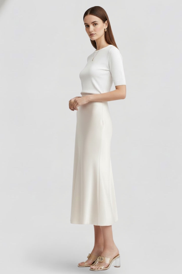 Women's elegant high waist white midi skirt with beautiful drape. Modern, chic, and perfect for any occasion.