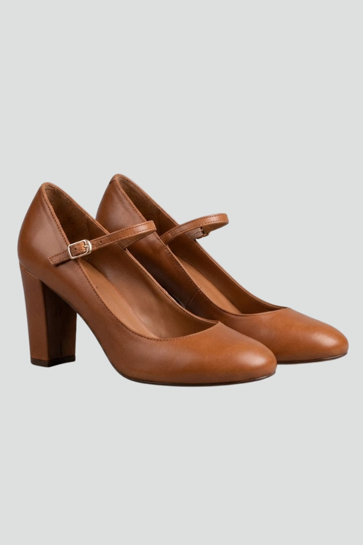 Stylish women's buckle strap low heel sandals for comfortable, elegant summer wear. Adjustable fit.