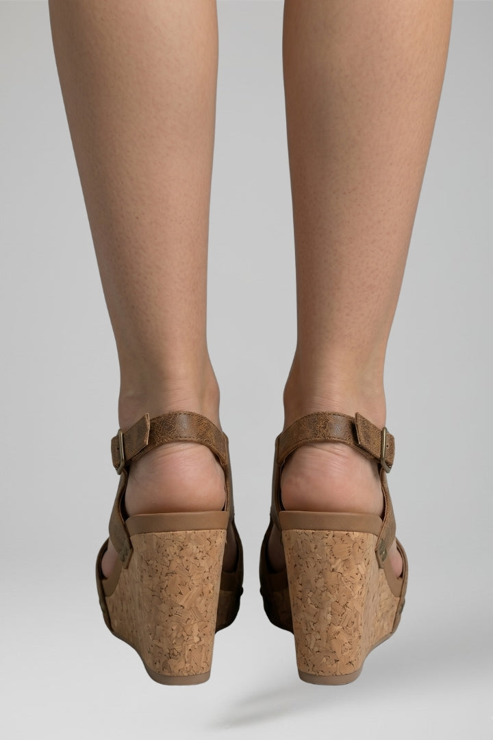 Fashionable women's strappy platform wedge heel sandals, essential comfortable summer footwear.