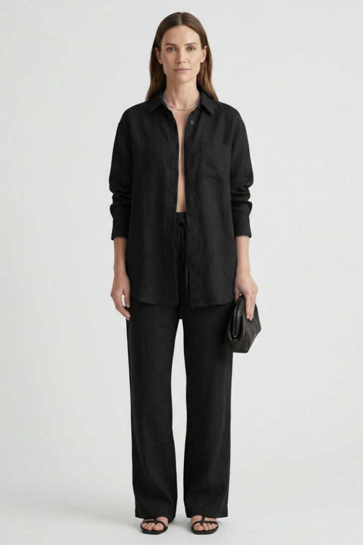 Stylish women's two-piece set with a collared button shirt & straight-cut trousers. Modern women's fashion.