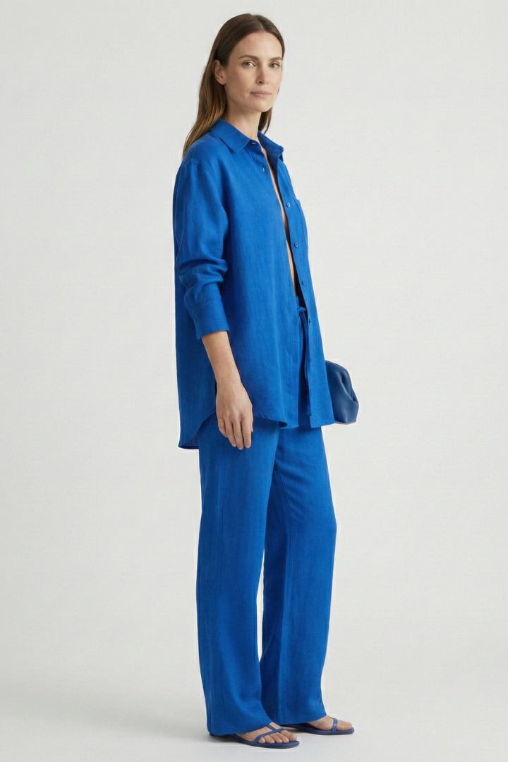 Business casual women's two-piece set: button shirt & straight pants. Elegant spring/summer fashion.