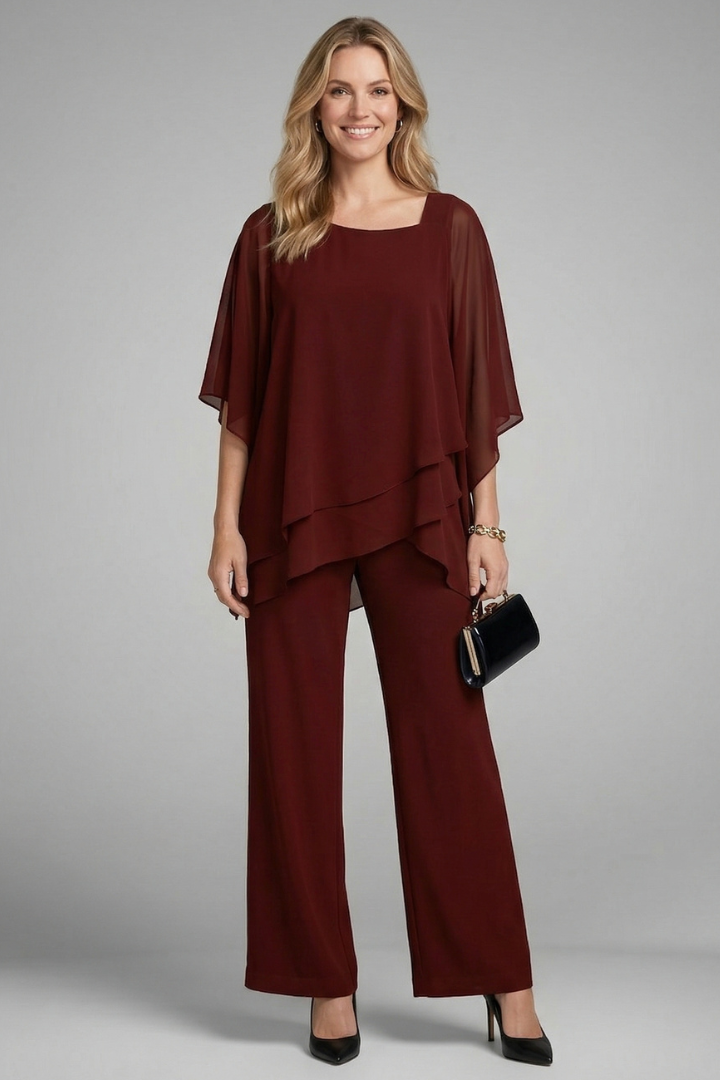 Fashionable women's asymmetrical top & wide-leg pants set. Stylish, comfortable & perfect for modern casual wear.