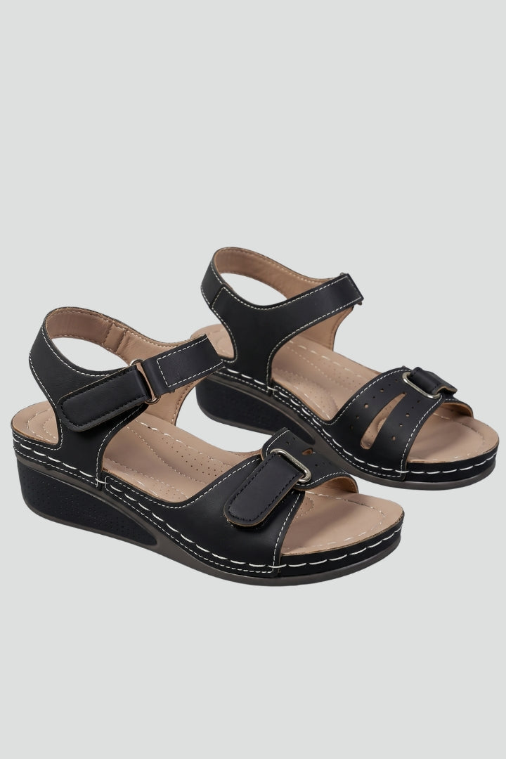 Women's beige wedge sandals with cushioned insole & adjustable strap, perfect for comfortable summer wear & everyday style.