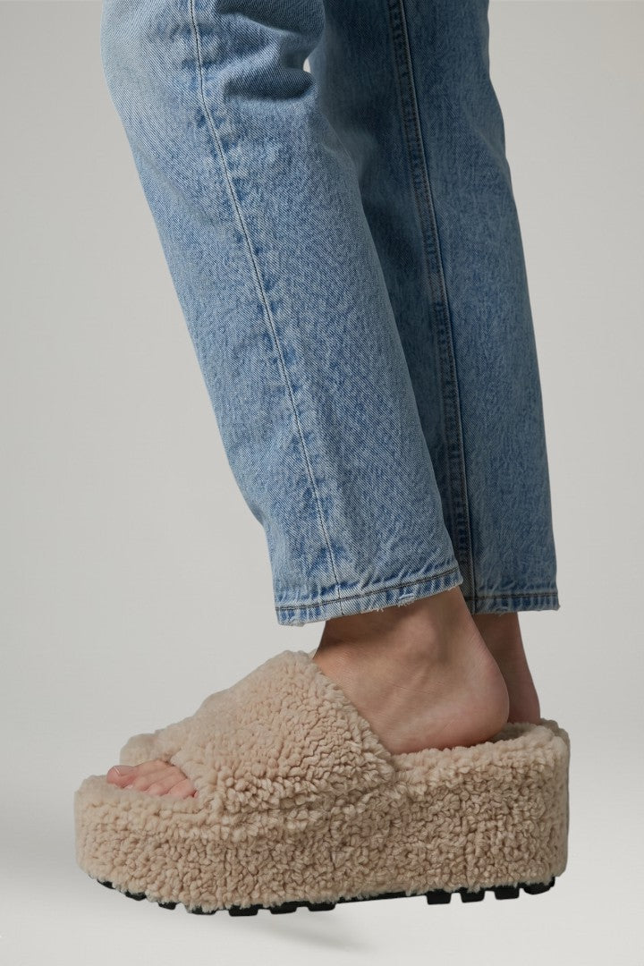 Chic women's slip-on wedge sandals, featuring a comfortable cushioned insole and trendy platform sole.