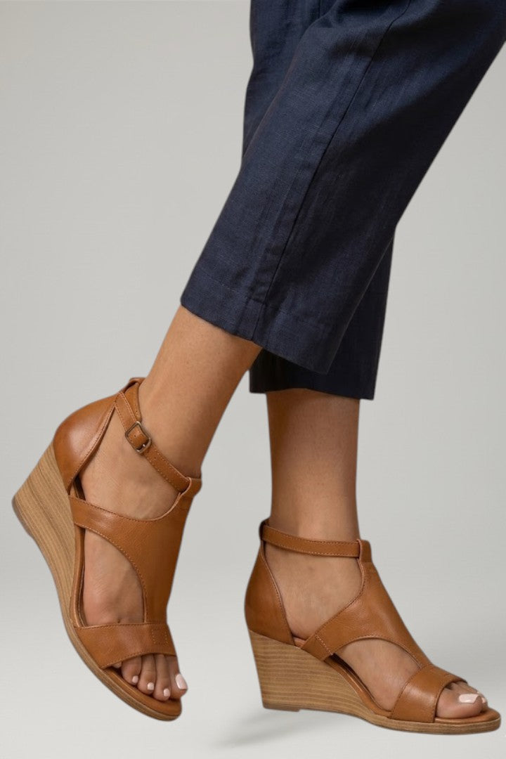Dressy women's summer T-strap wedge sandals, designed for all-day comfort with cushioned support.