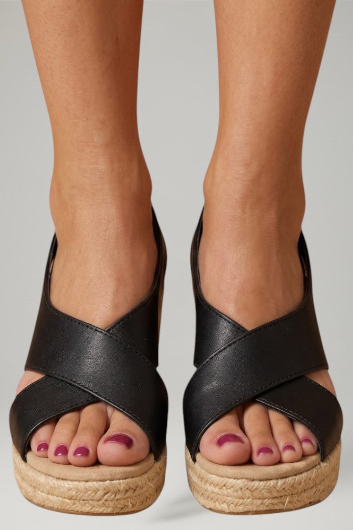 Stylish women's wedge sandals with secure ankle strap & woven sole, perfect for comfortable summer wear.