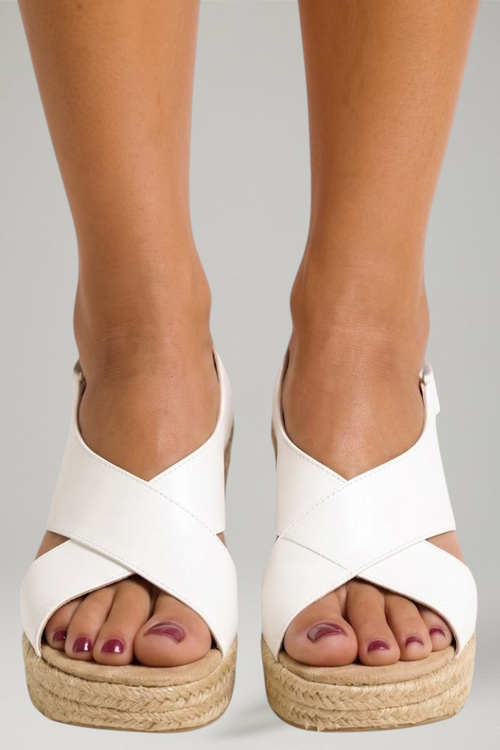 Secure-fit women's wedge sandals with comfortable woven sole and adjustable ankle strap, ideal for summer.