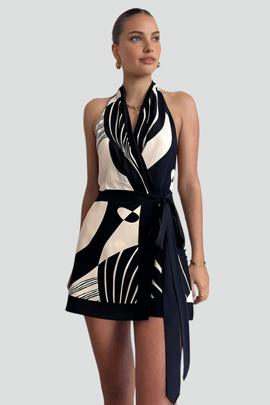 Women's stylish black wrap mini dress with a halter neckline and adjustable tie waist, ideal for summer evenings.