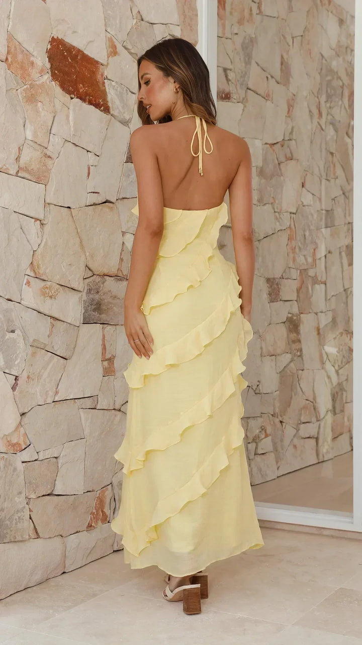 Stylish women's tiered & ruffled maxi dress with a halter neckline, ideal as a party or summer sundress.