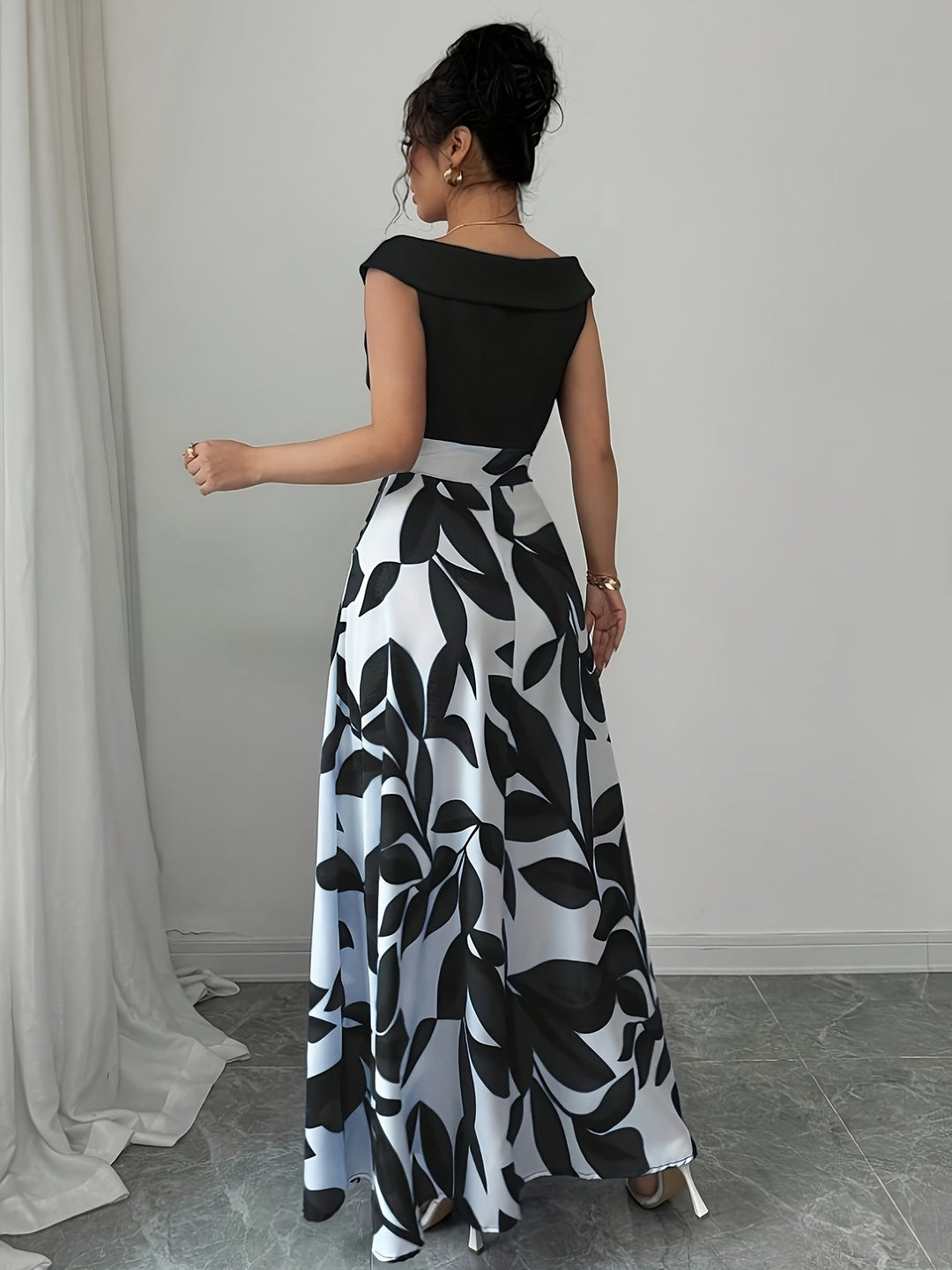 Close-up of the elegant V-neck and flowing A-line skirt of a women's maxi dress, perfect for wedding guests.