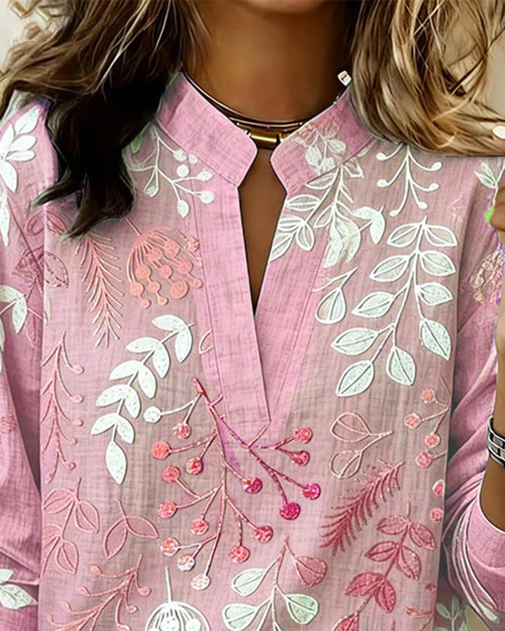 Stylish Women's Top with pastel floral print and V-neck, perfect for any occasion.