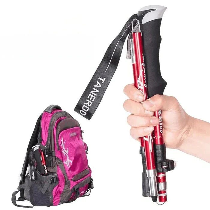 "Adjustable lightweight trekking poles, foldable design, available in black, blue, or red, perfect for hiking and stability."