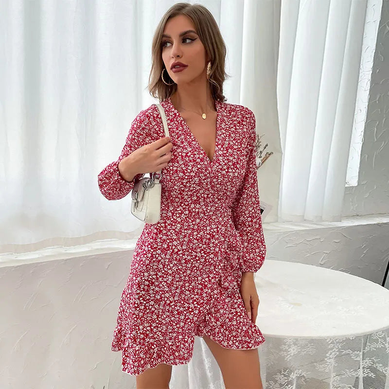 Beautiful women's floral wrap mini dress featuring V-neck, long sleeves, ruffle detail, and adjustable tie waist.